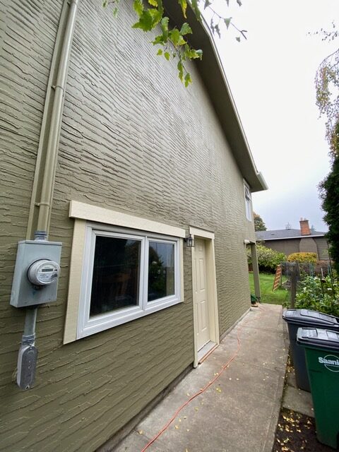 Stucco home after elastomeric coatings